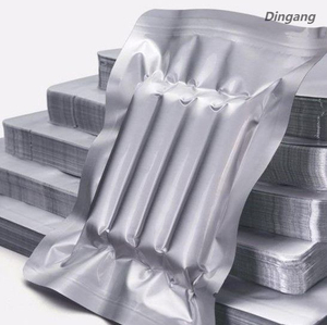 Pel&iacute;cula compuesta de aluminio para envasado al vac&iacute;o para conservaci&oacute;n de la frescura sin ox&iacute;geno y fabricaci&oacute;n de bolsas al vac&iacute;o de alta barrera